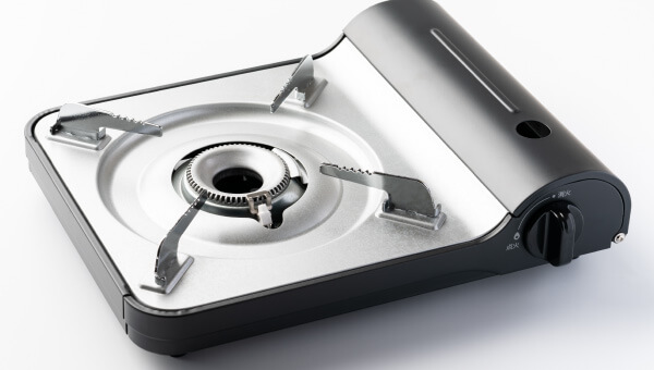 Cartridge gas cooking stoves